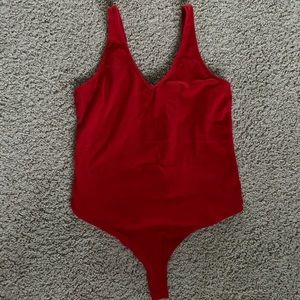 bright red bodysuit